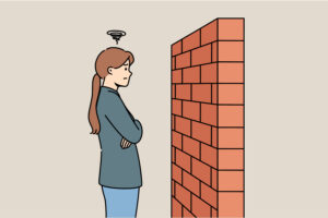 dessin d'une femme face à un mur, bloquée et réfléchissant